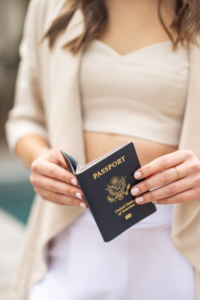 Close-up of a woman’s hands holding a passport. 